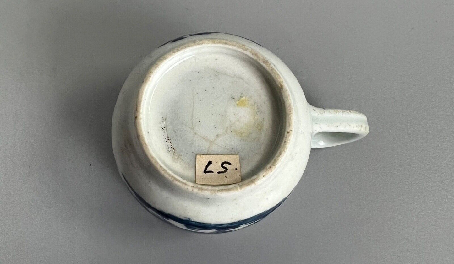 A mid 18thc First Period Worcester "Plantation" pattern coffee cup c.1765