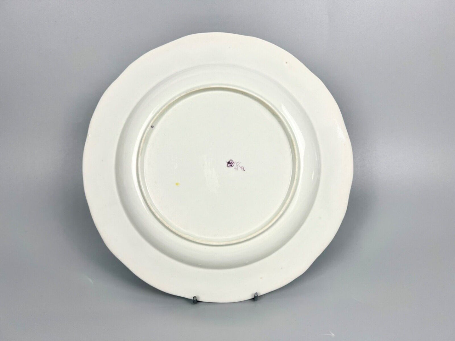 A very rare Derby plate 1785-90 painted as a replacement by William Billingsley
