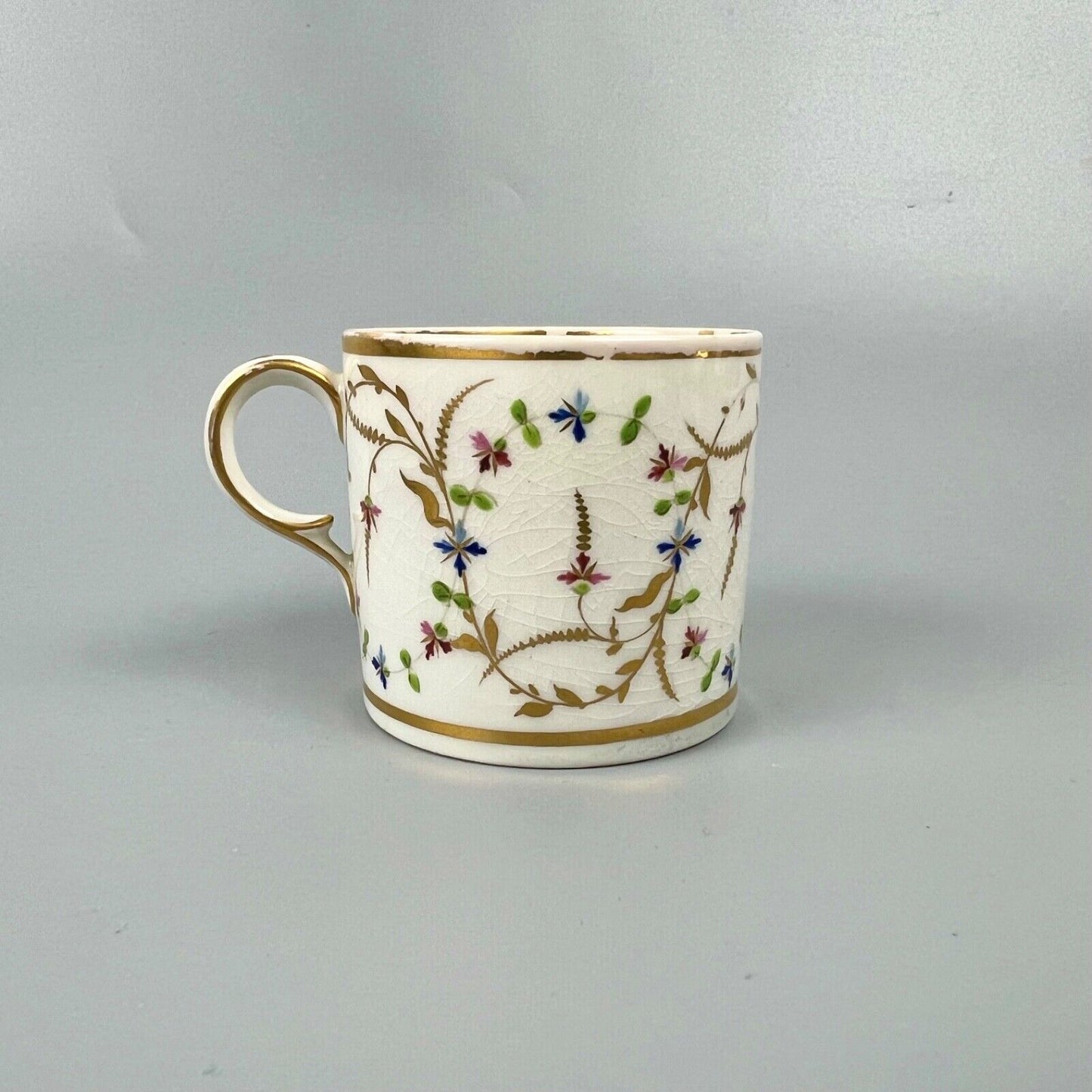A late 18thc Derby Porcelain cup in pattern number 552. Puce mark. c1795