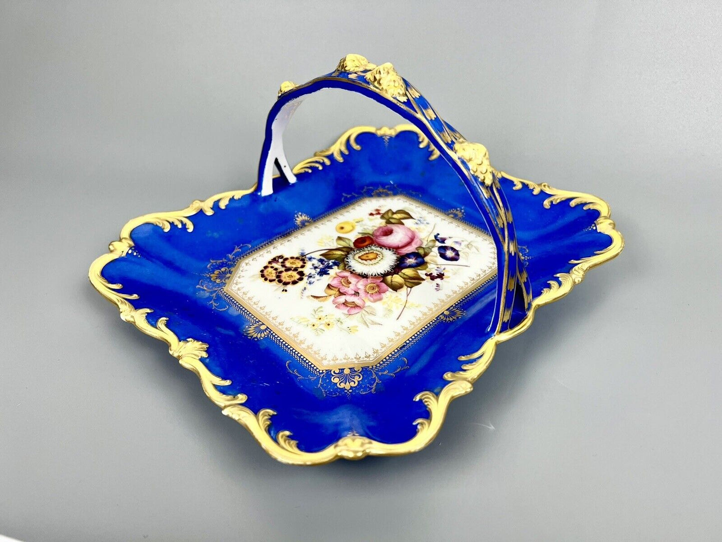 A lovely Samuel Alcock fruit basket finely painted with garden flowers. c.1830
