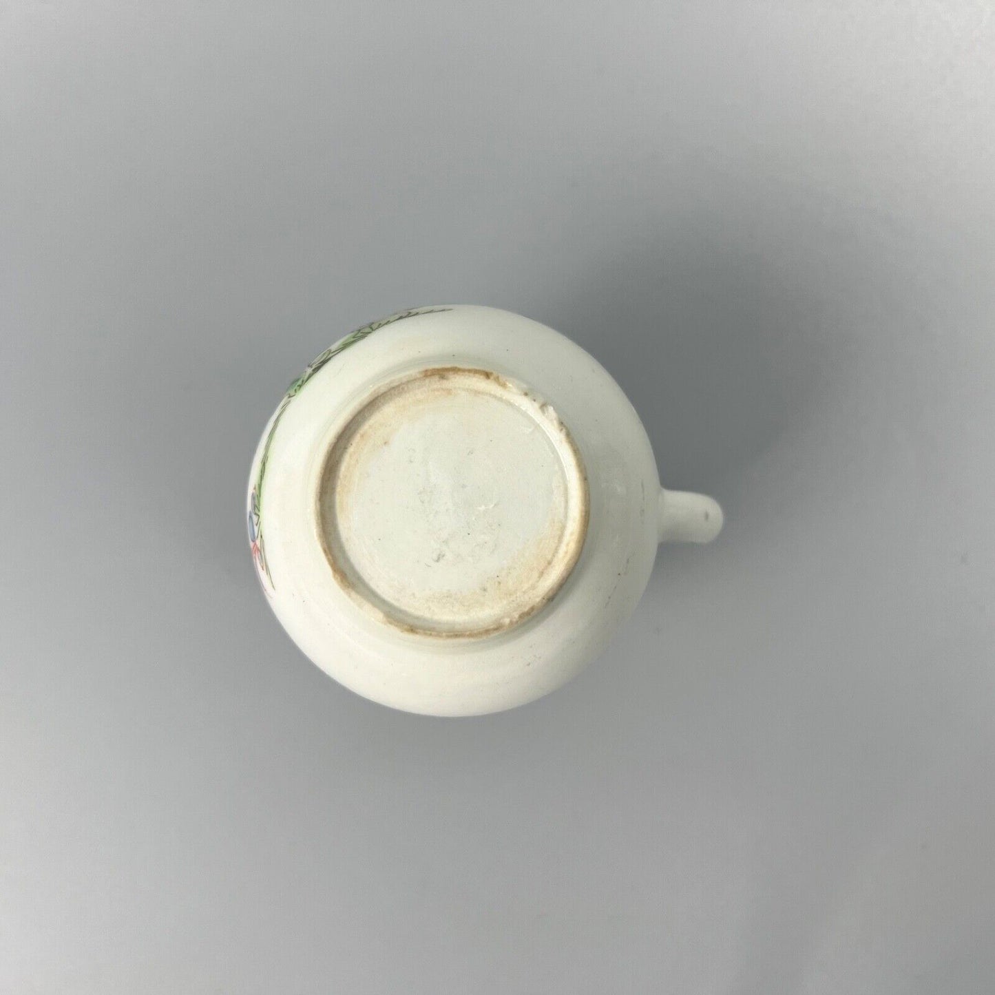 An early Bow creamer painted in famille rose style c1750-3
