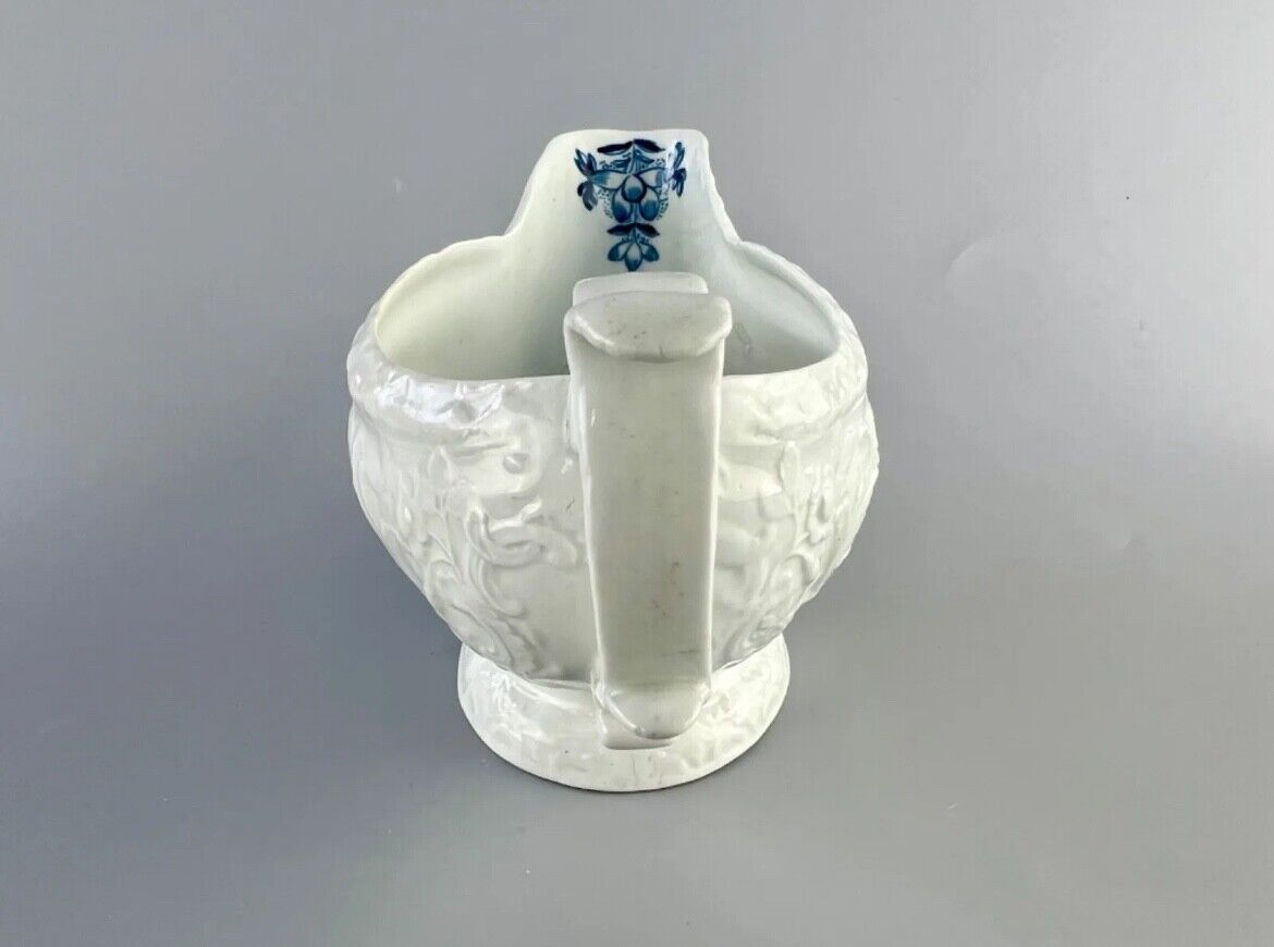 Christian Liverpool porcelain moulded sauceboat with oriental decoration. c.1770