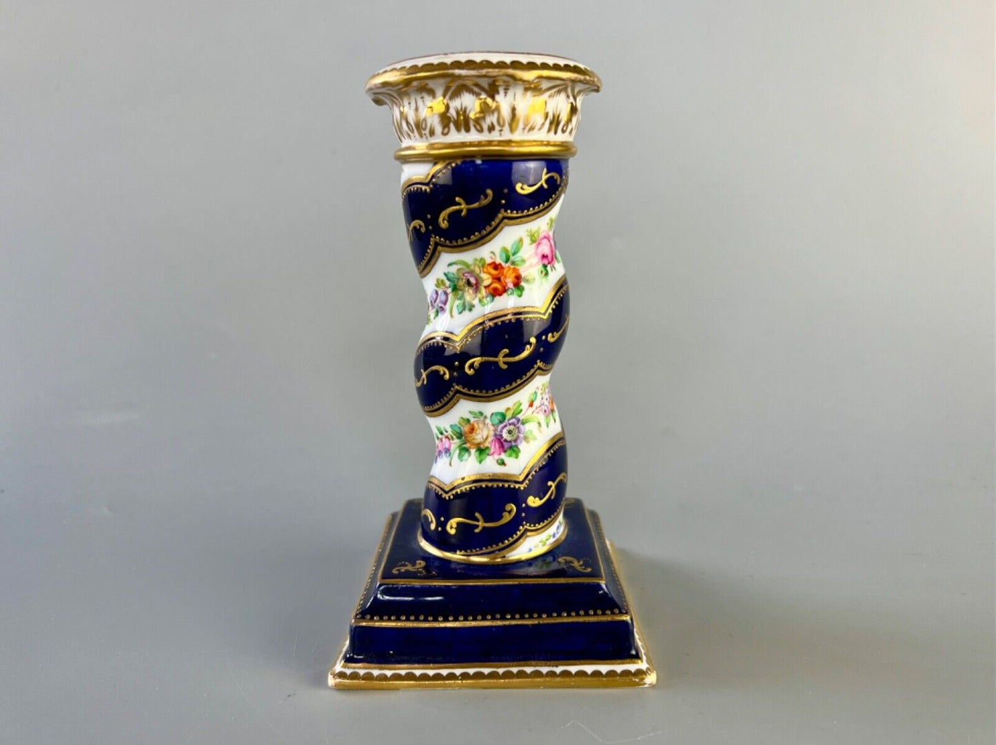 A pair of c 1810-25 Coalport Coalbrookdale spiral-moulded candlesticks.