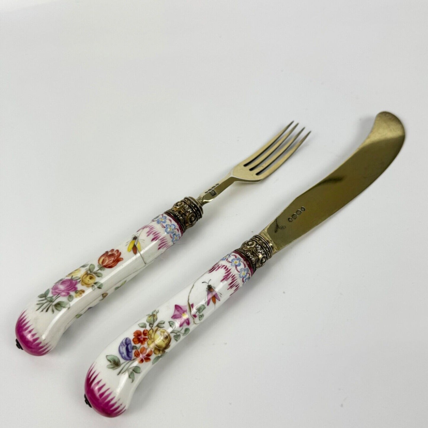 A sterling silver-gilt knife & fork set-the silver c.1863, the porcelain c.1760