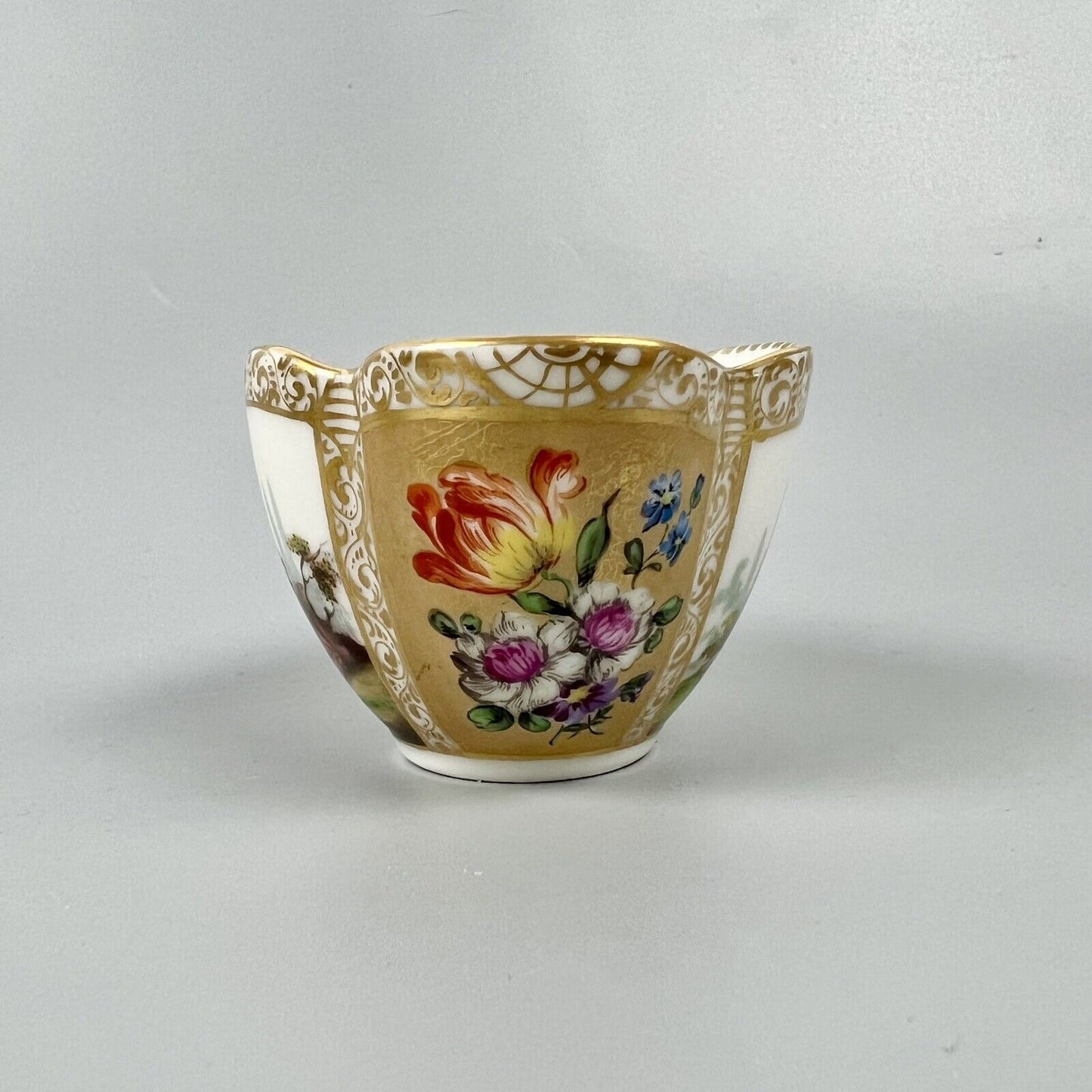 Dresden quatrefoil teacup & saucer painted with romantic scenes. 'AR' mark c1880
