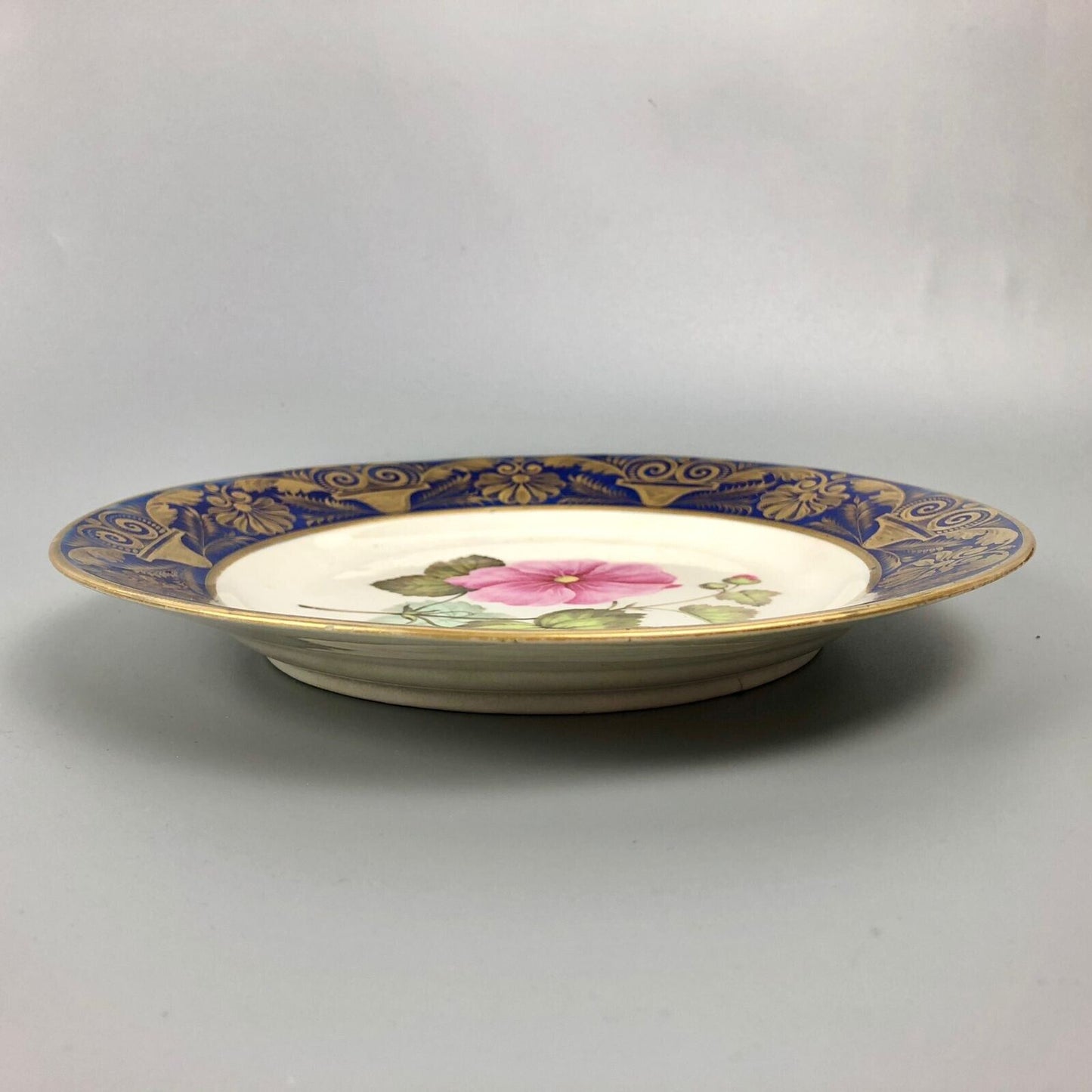 A Quaker Pegg-Painted Derby Plate With Seringapatum Hollyhock Study. c1813-15.