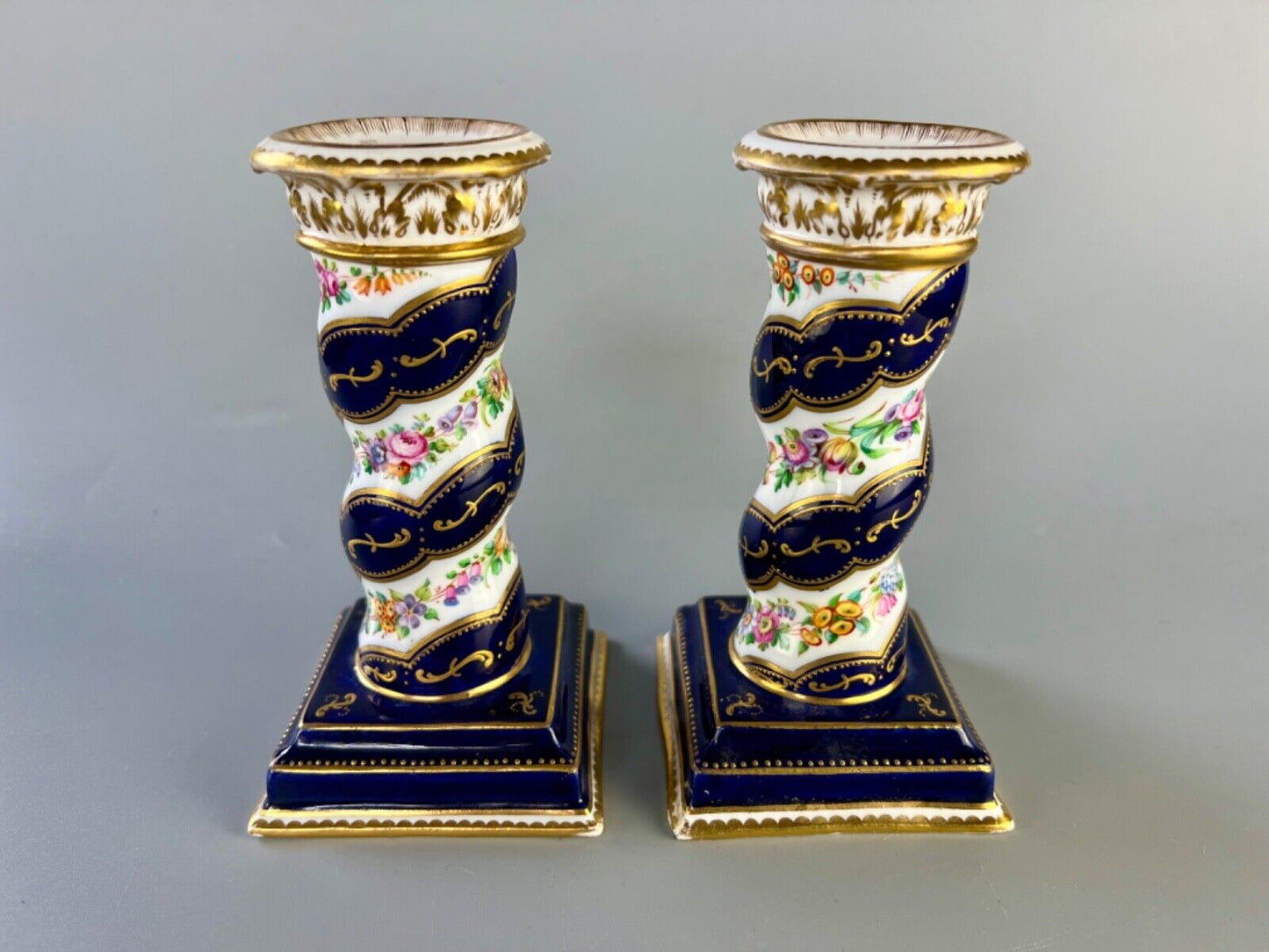A pair of c 1810-25 Coalport Coalbrookdale spiral-moulded candlesticks.