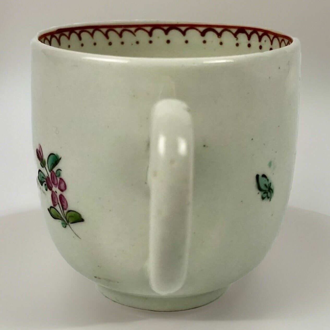 A c.1765-75 Liverpool Philip Christian polychrome floral painted coffee cup