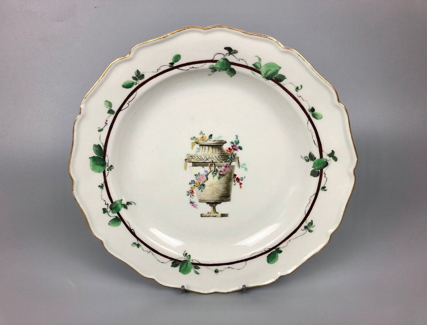 A James Giles decorated 1st Period Worcester plate painted with an urn c.1770