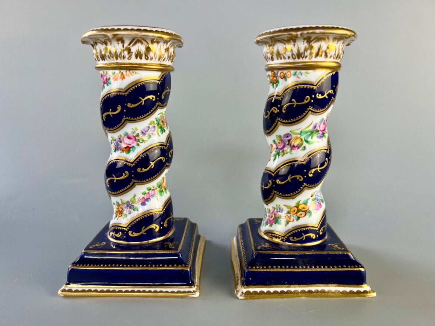 A pair of c 1810-25 Coalport Coalbrookdale spiral-moulded candlesticks.