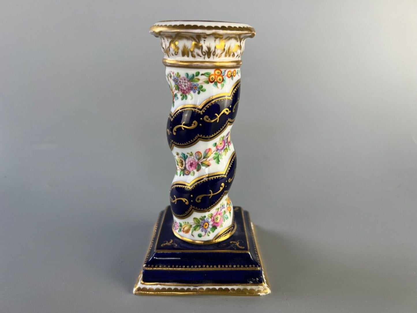 A pair of c 1810-25 Coalport Coalbrookdale spiral-moulded candlesticks.