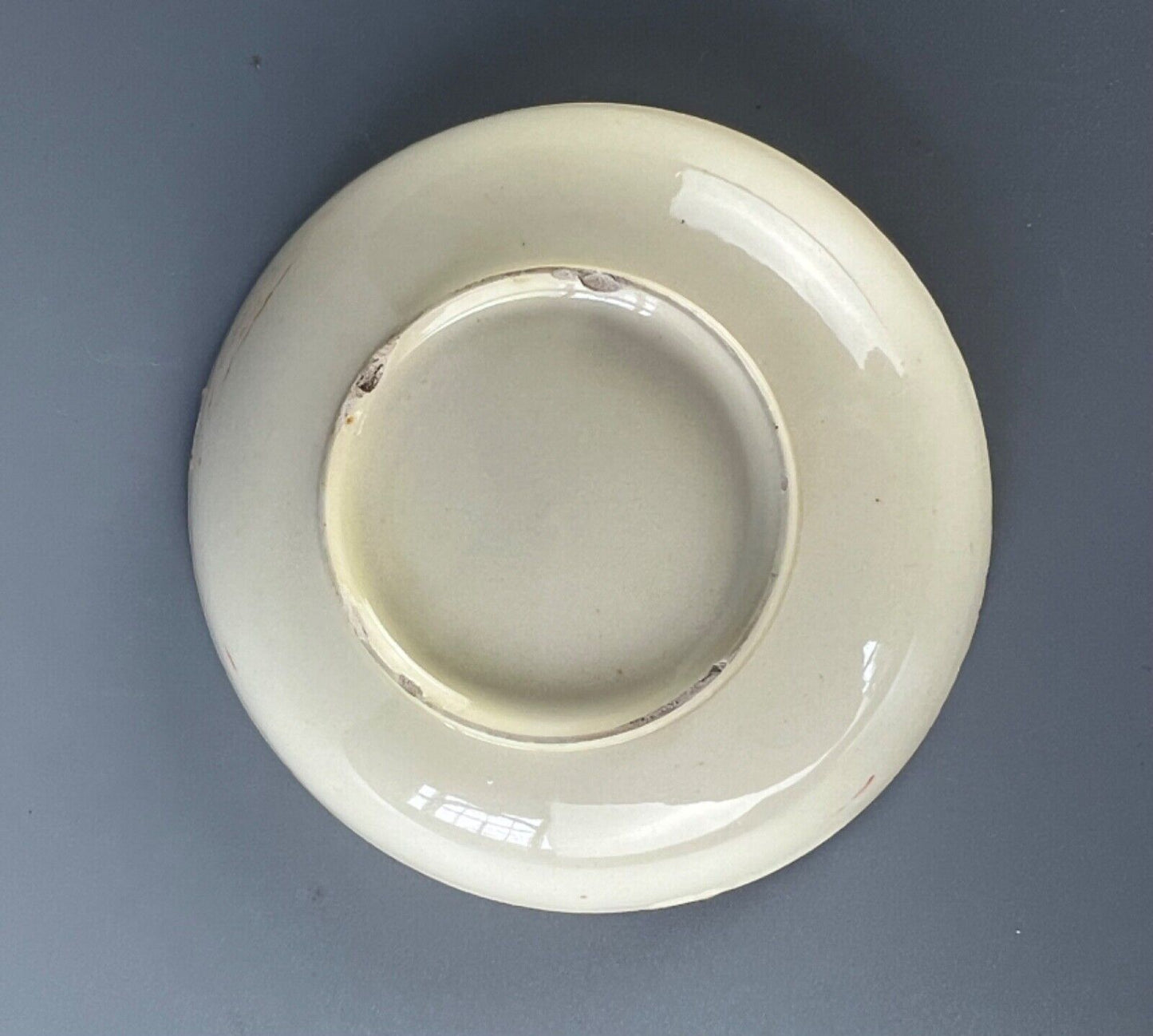A rare and charming late 18thc miniature creamware hand painted saucer