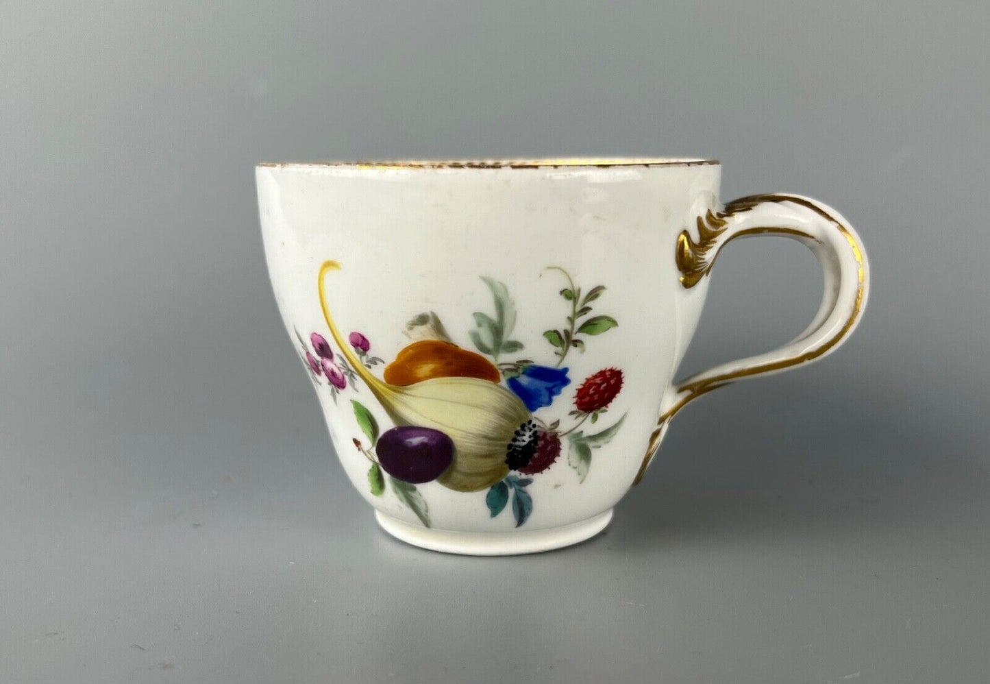 A set of four Meissen Marcolini Period c.1800 bifurcated-handle coffee cups.