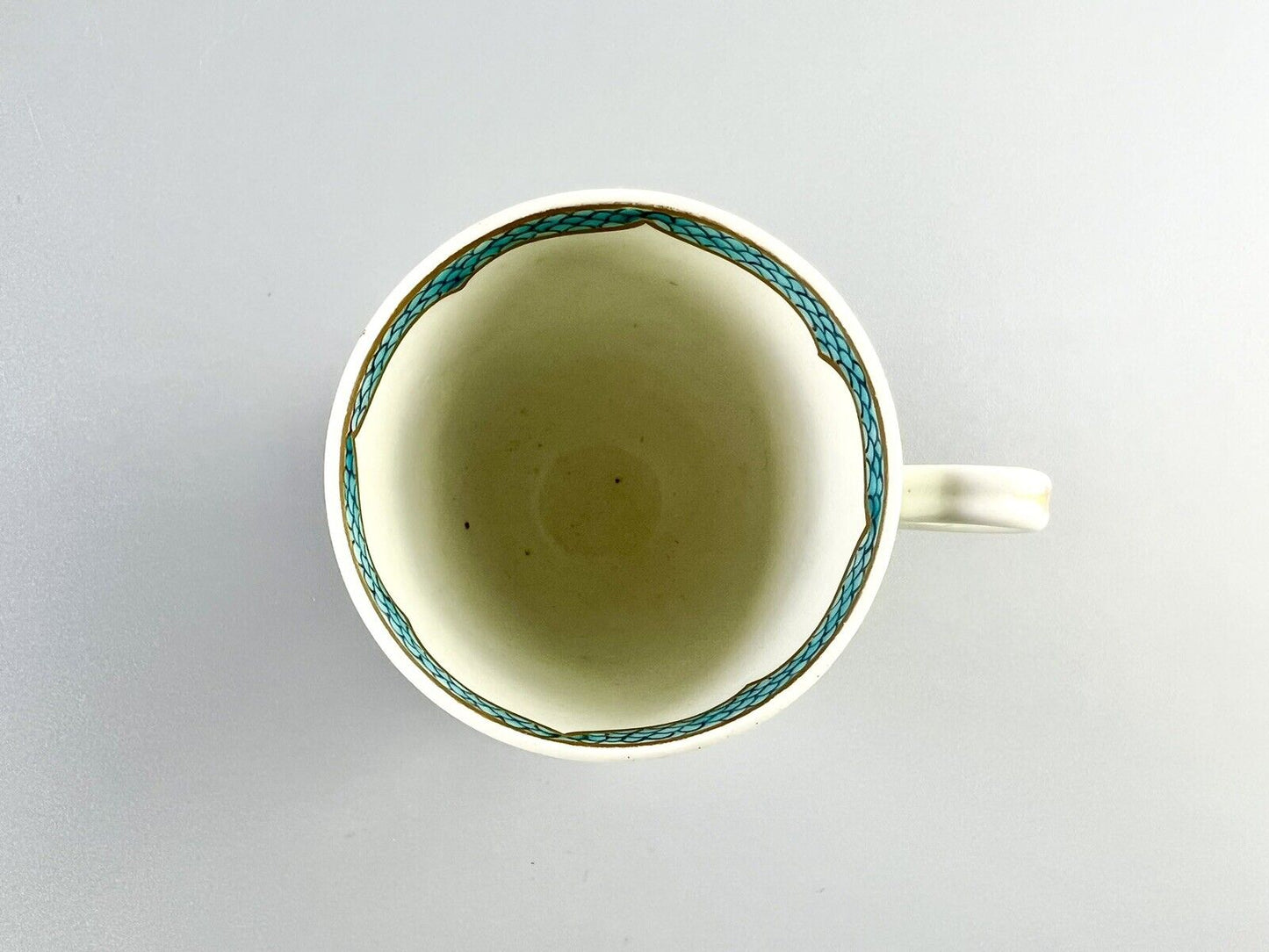 A 1st Period Worcester polychrome coffee cup c1770. Sprung handle.