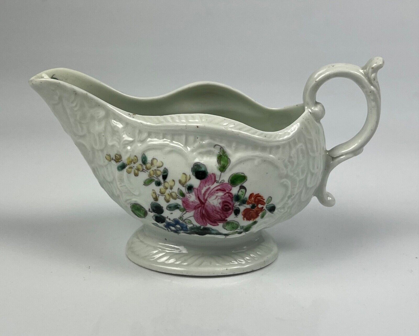 A Philip Christian Liverpool moulded polychrome porcelain sauceboat c.1770