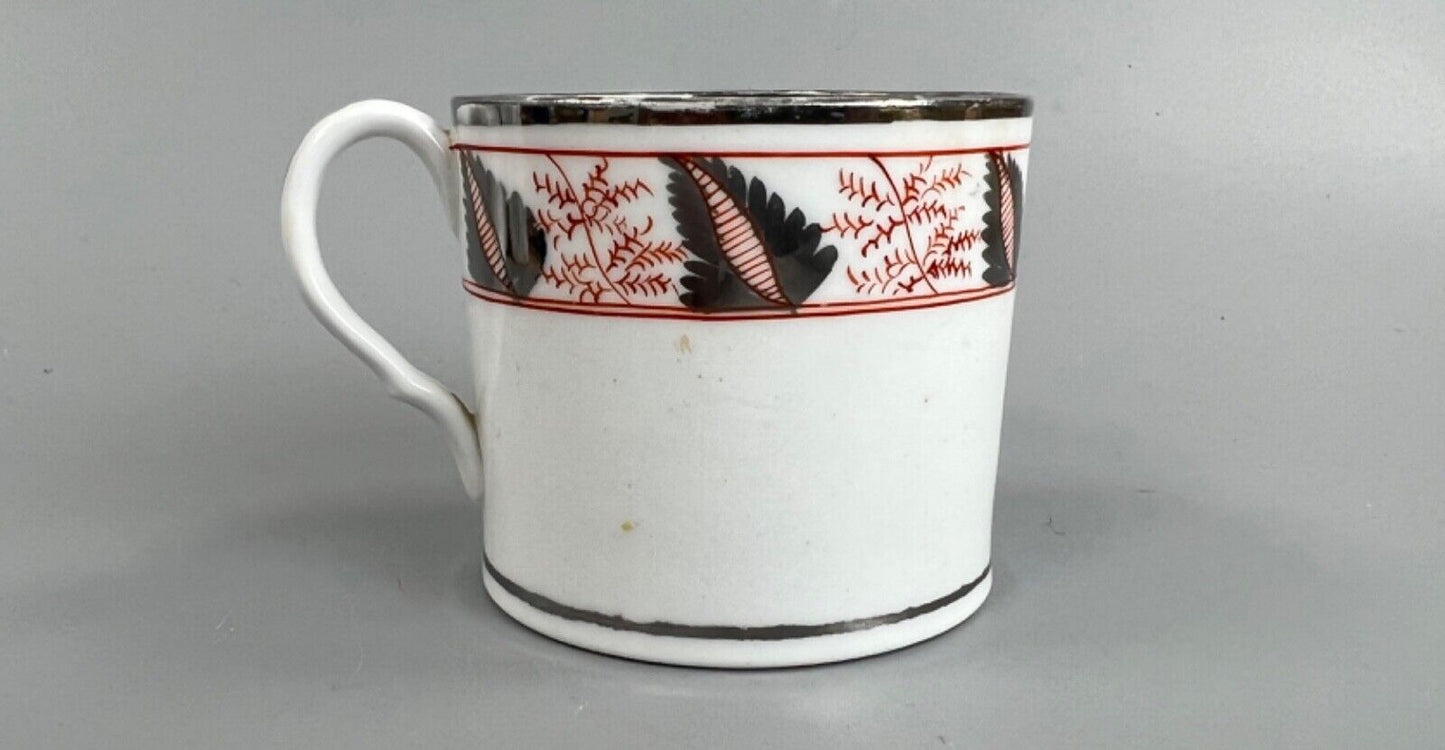 An early 19thc Coalport coffee can with silver lustre decoration.