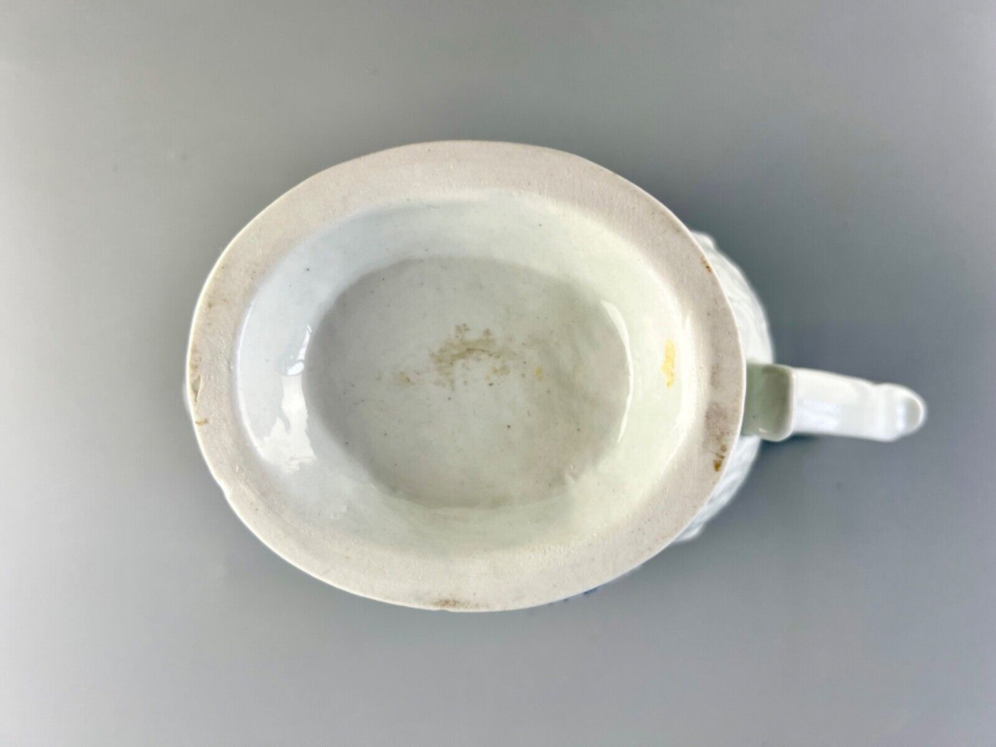 A Worcester porcelain 'Two Porters Landcsape v.1' pattern sauceboat c1770