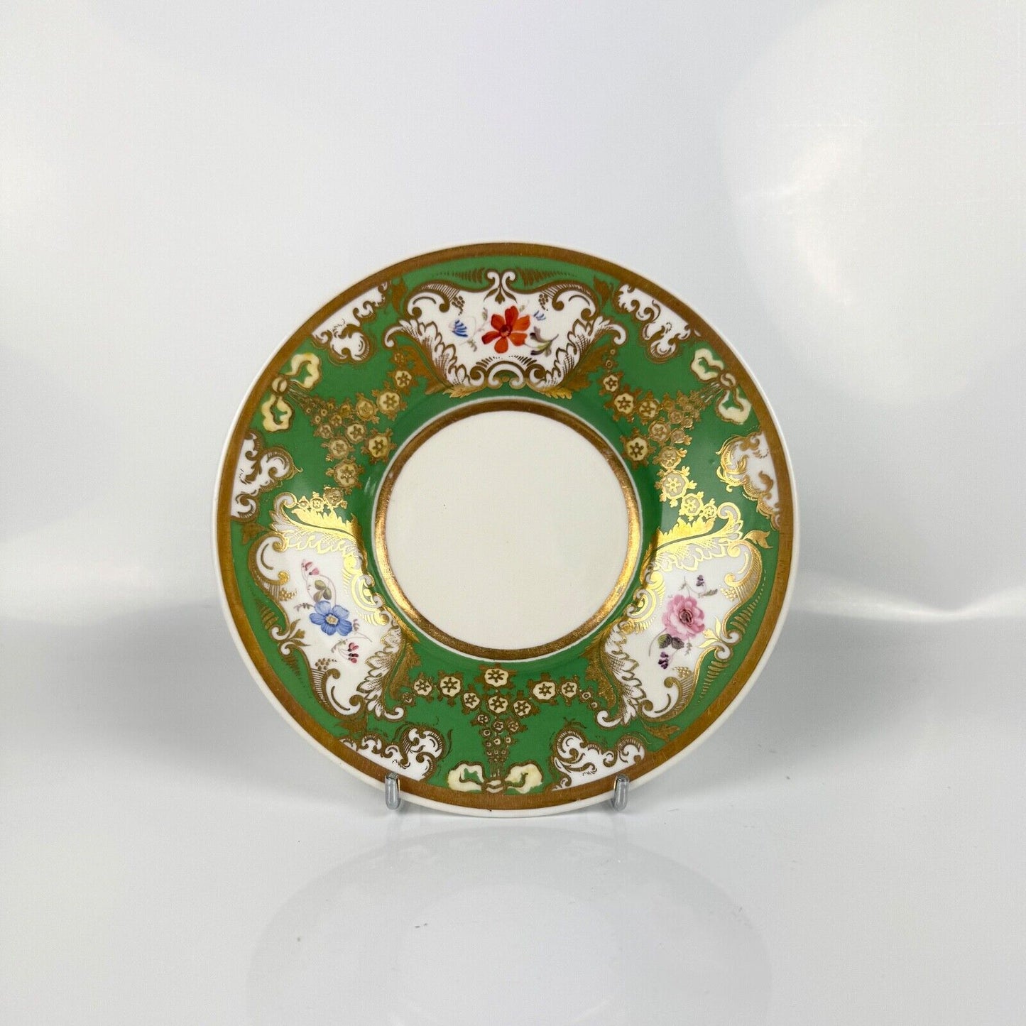 Rockingham horsetail & hoof handled coffee cup& saucer. Red griffin mark. c1826.
