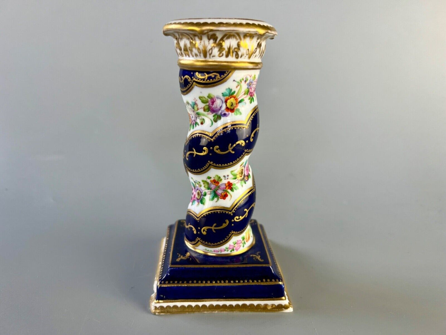 A pair of c 1810-25 Coalport Coalbrookdale spiral-moulded candlesticks.