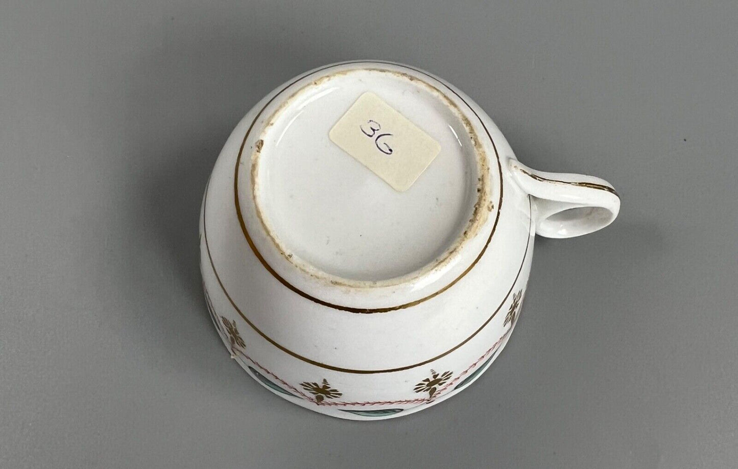An early 19thc bute shape New Hall cup and saucer in pattern number 1152