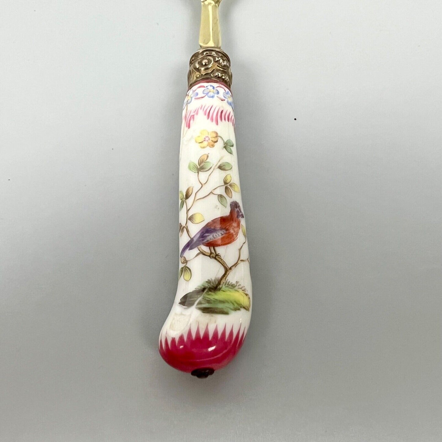 A sterling silver-gilt knife & fork set-the silver c.1863, the porcelain c.1760