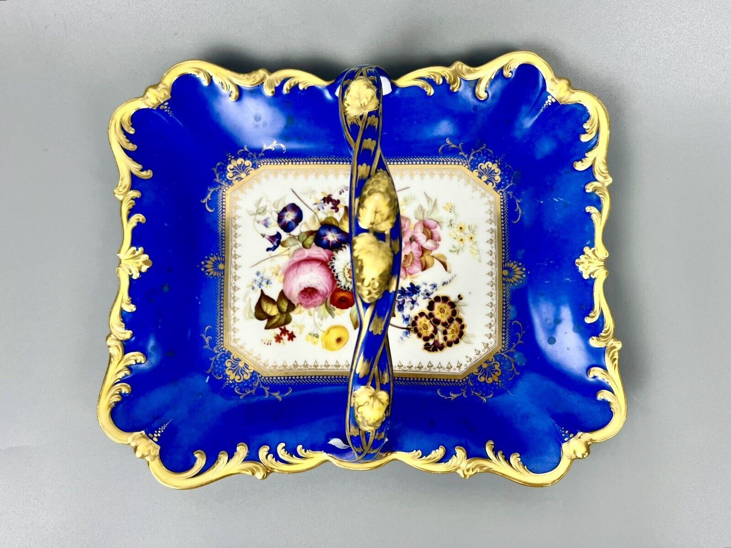 A lovely Samuel Alcock fruit basket finely painted with garden flowers. c.1830