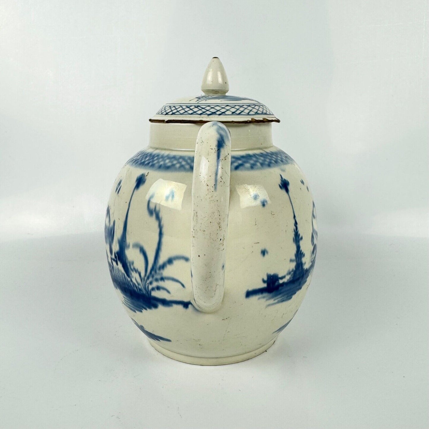 A Staffordshire c1790 hand-painted with a chinoiserie scene pearlware teapot.