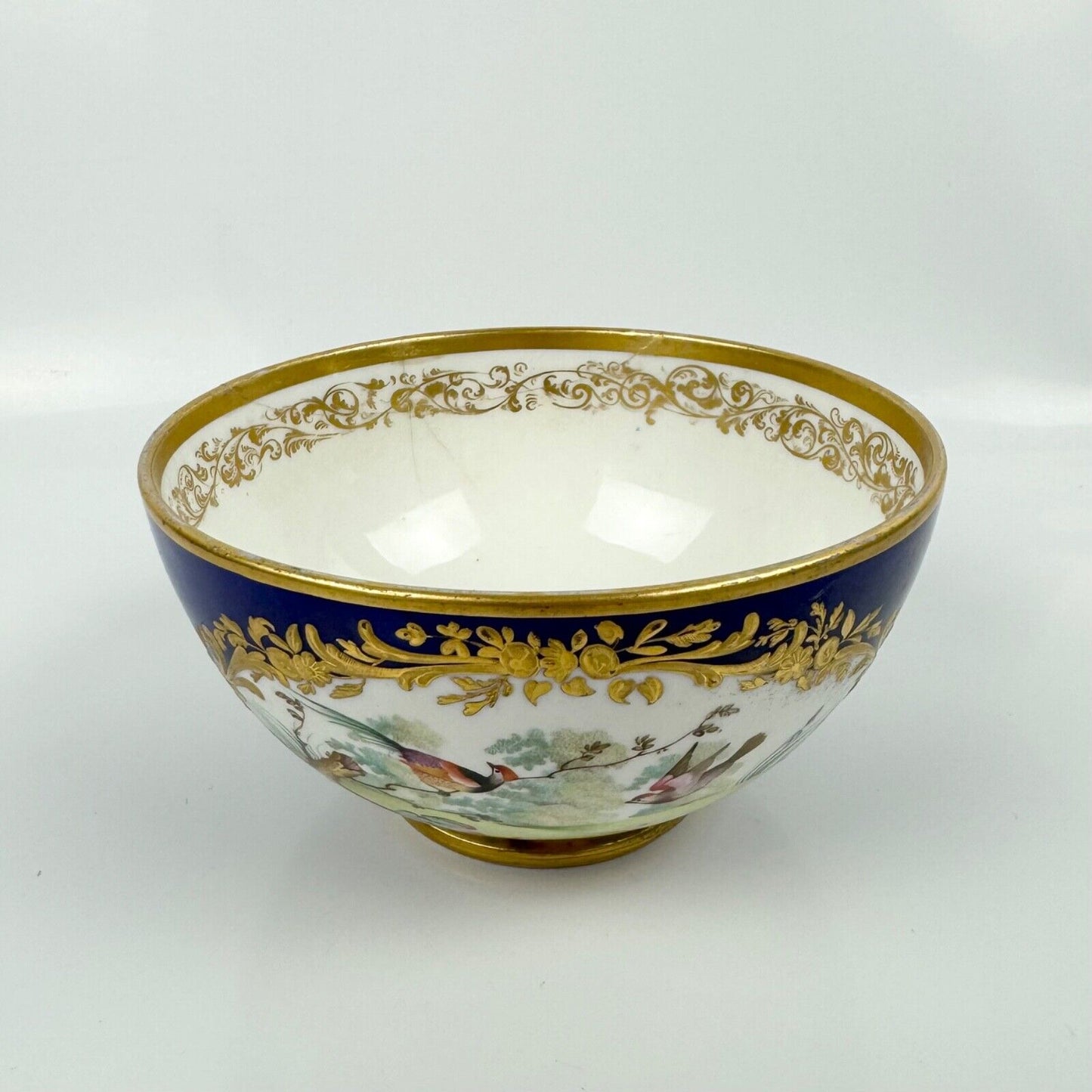 A Sèvres-style Derby bowl painted with exotic birds. Mock Sèvres mark. c.1835-40