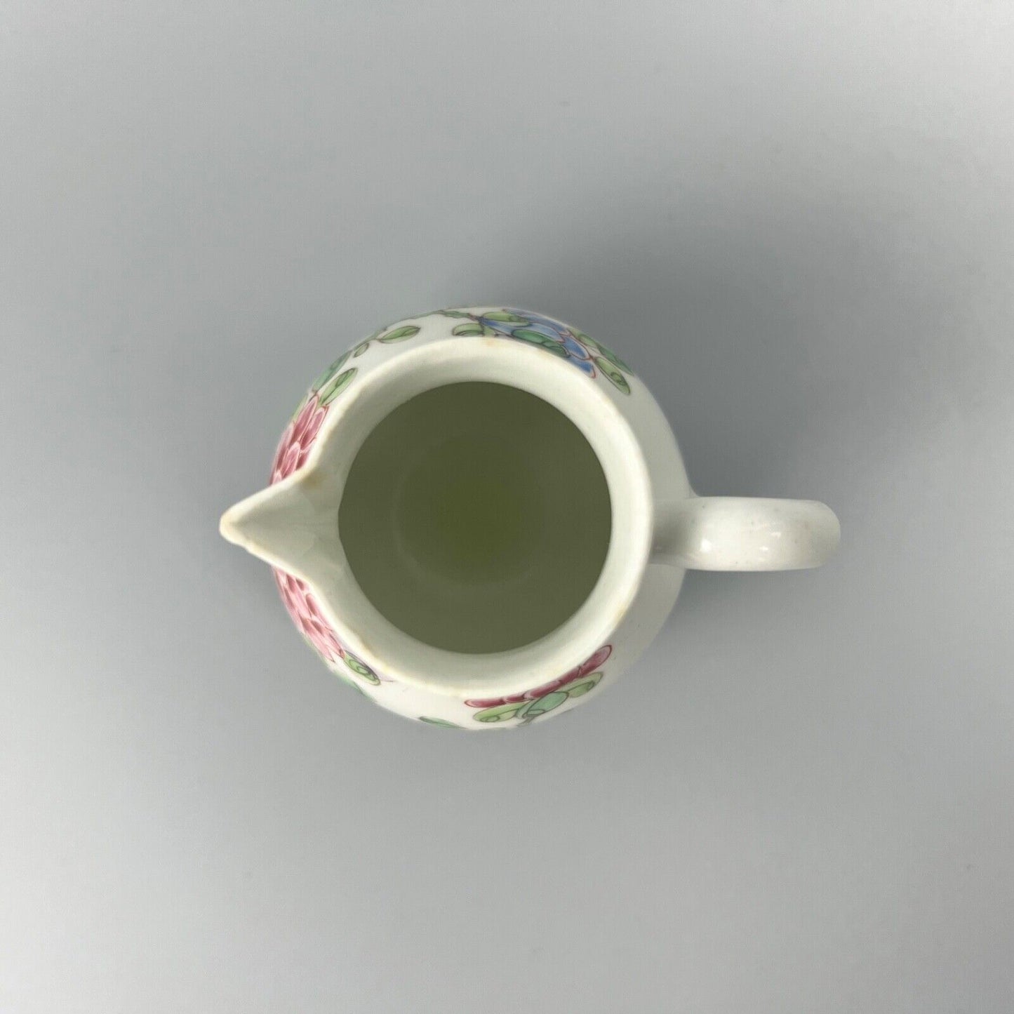 An early Bow creamer painted in famille rose style c1750-3
