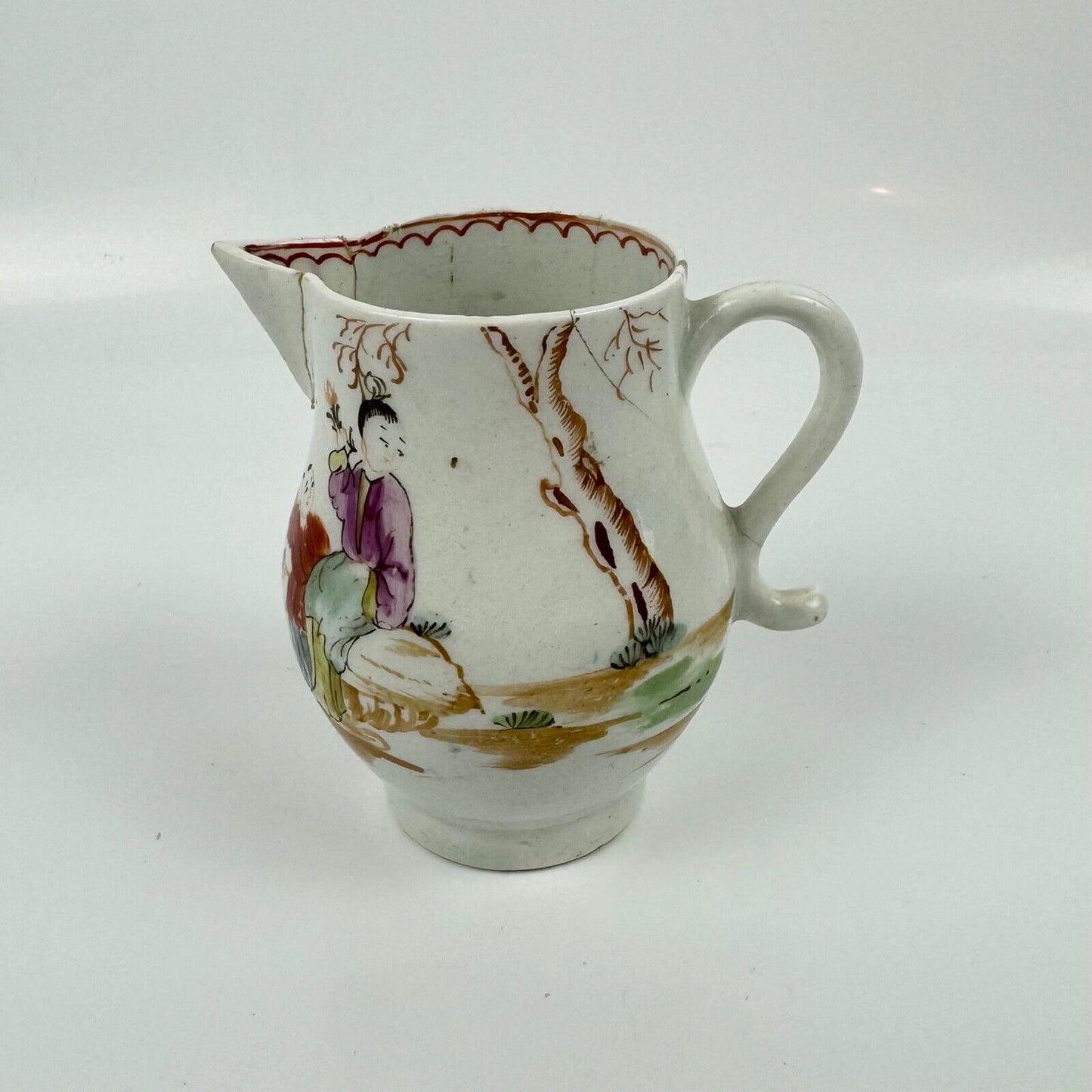 A Lowestoft sparrowbeak creamer c1775 painted with an Oriental figural pattern