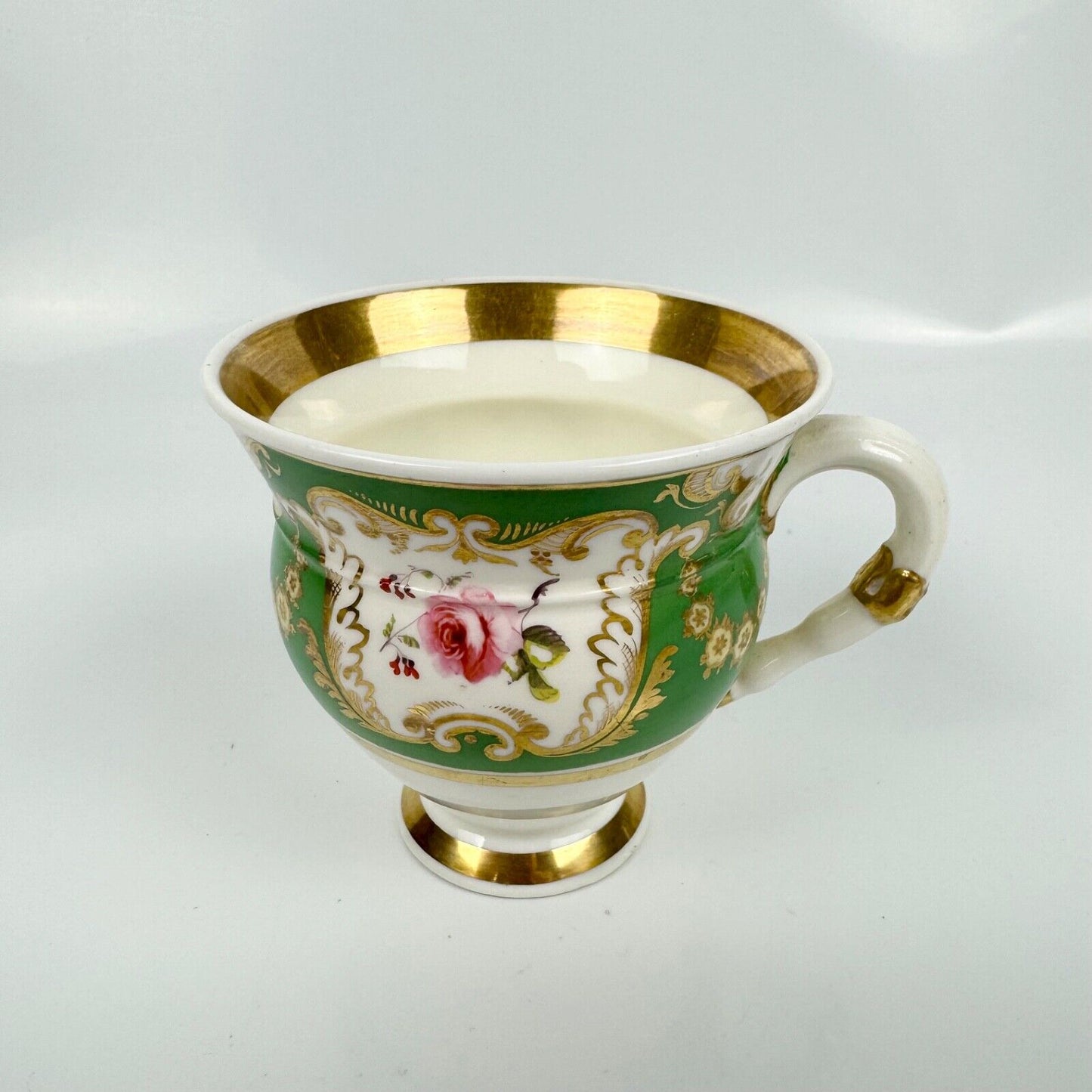 Rockingham horsetail & hoof handled coffee cup& saucer. Red griffin mark. c1826.