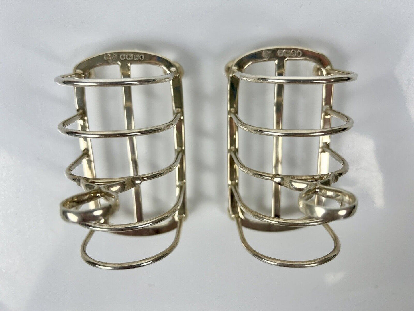 A Pair Of Goldsmith And Silversmith's Company Toastracks. Sheffield 1935.