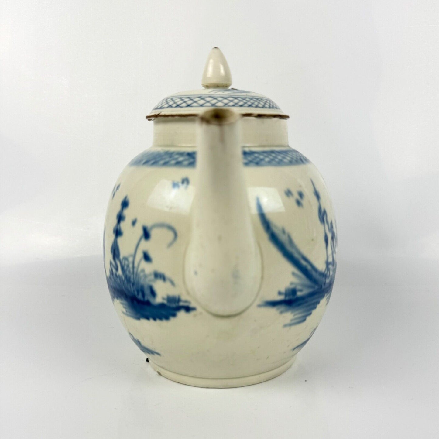 A Staffordshire c1790 hand-painted with a chinoiserie scene pearlware teapot.