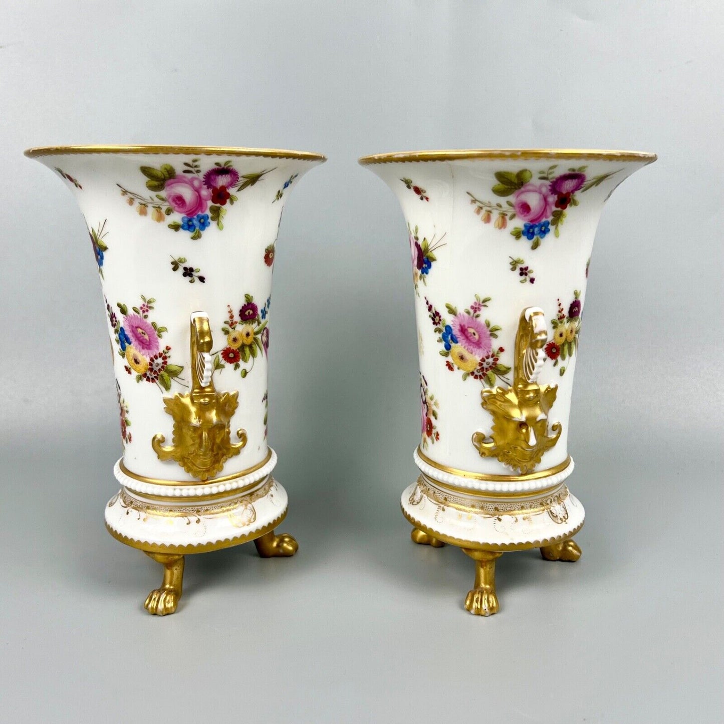 A pair of early 19th century vases in Swansea style c1810