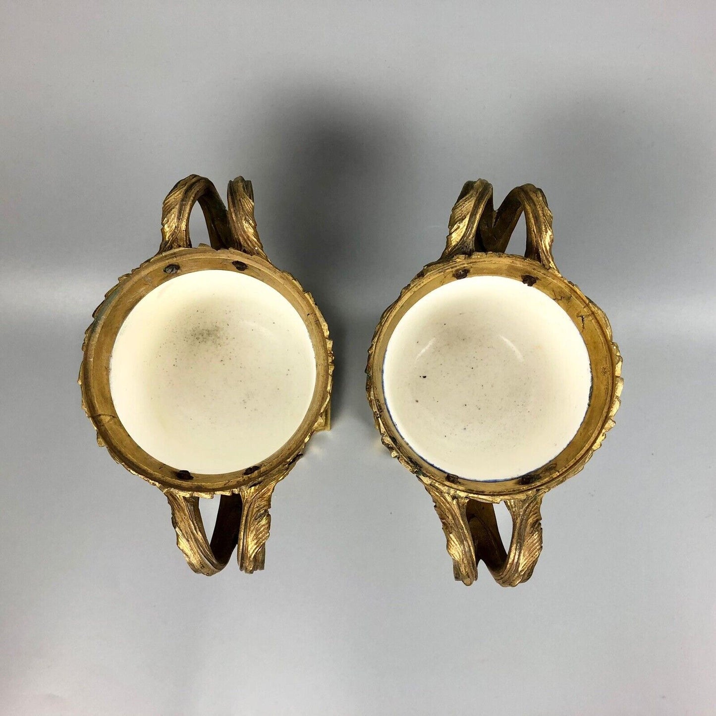 A pair of ormolu Sèvres-style vases painted with exotic birds and putti 1770