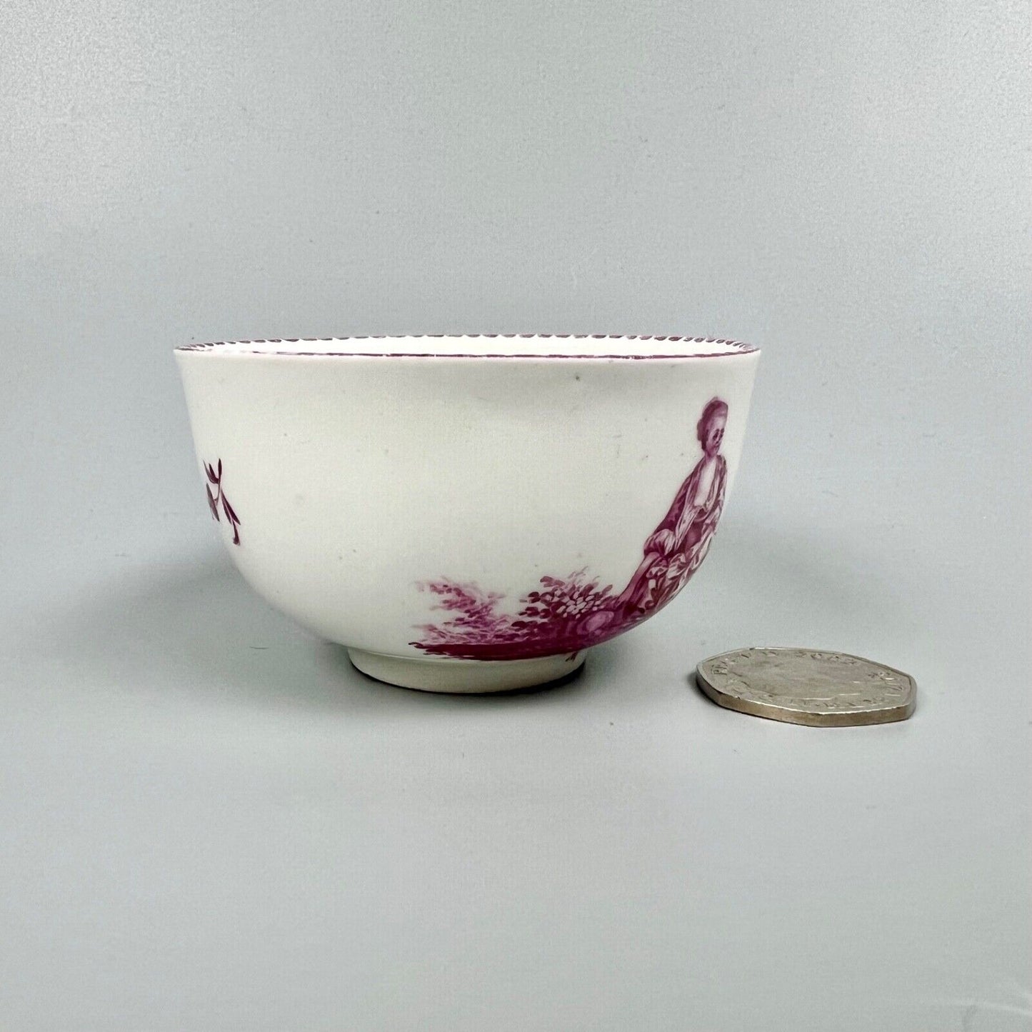 A Vienna porcelain teabowl painted with puce figures c1770-5