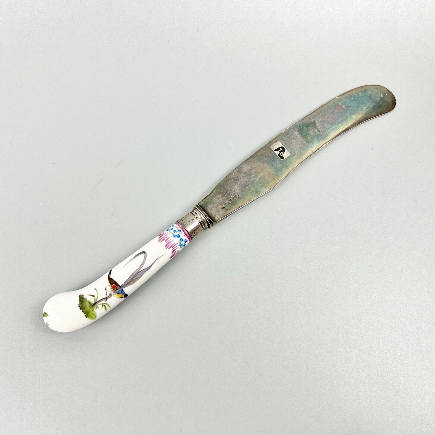 A large German-porcelain-handled steel-bladed dinner knife-the porcelain c.1760.