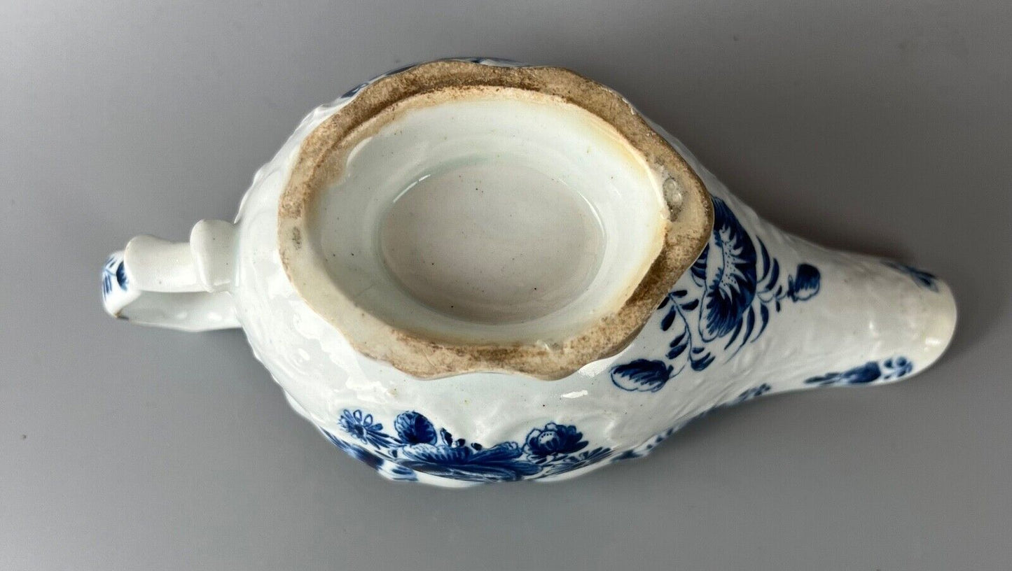 A mid 18thc Bow moulded sauceboat painted in underglaze blue c1765-70