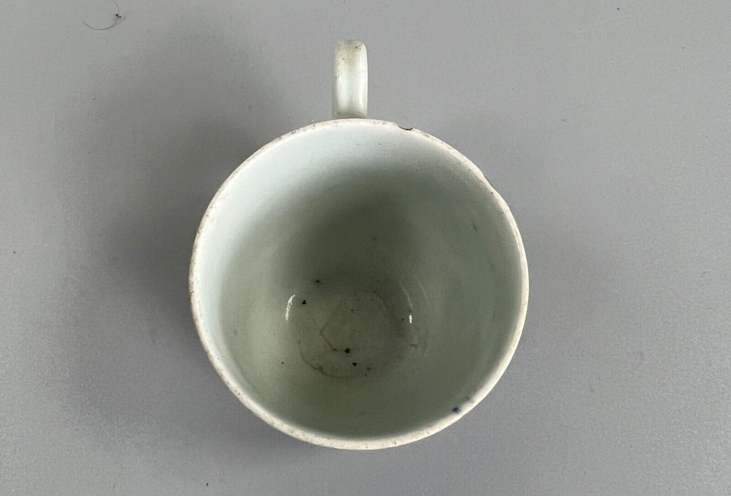 A mid 18thc First Period Worcester "Plantation" pattern coffee cup c.1765