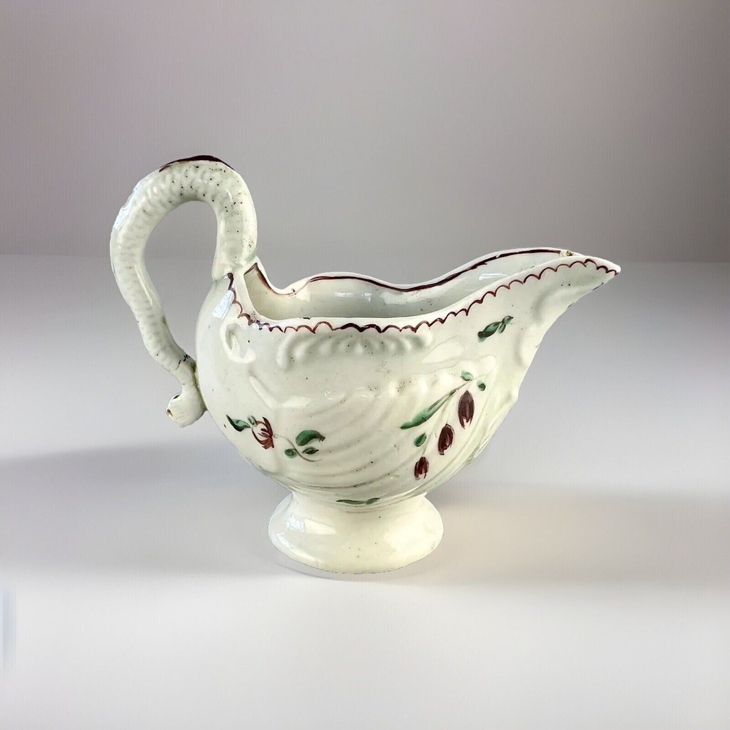 A Philip Christian Liverpool porcelain lamprey handled cream jug c.1775