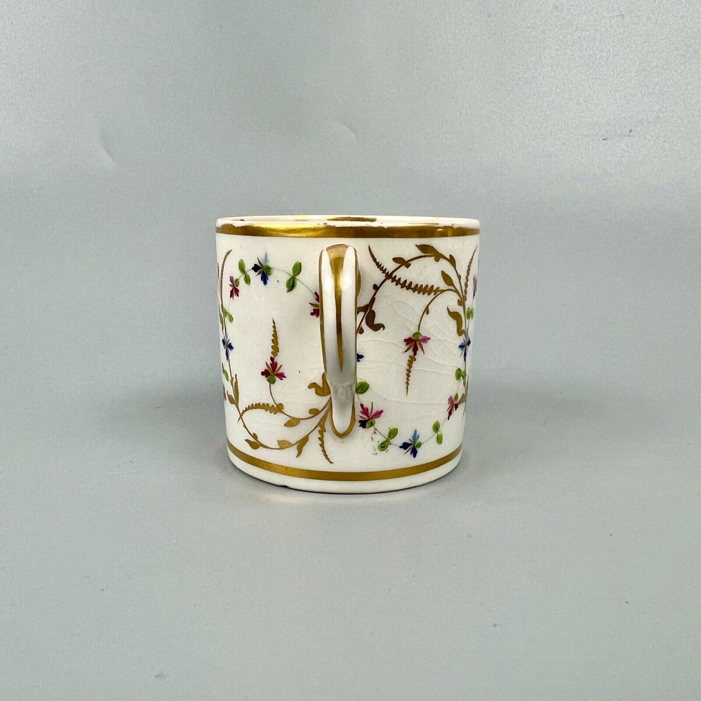A late 18thc Derby Porcelain cup in pattern number 552. Puce mark. c1795