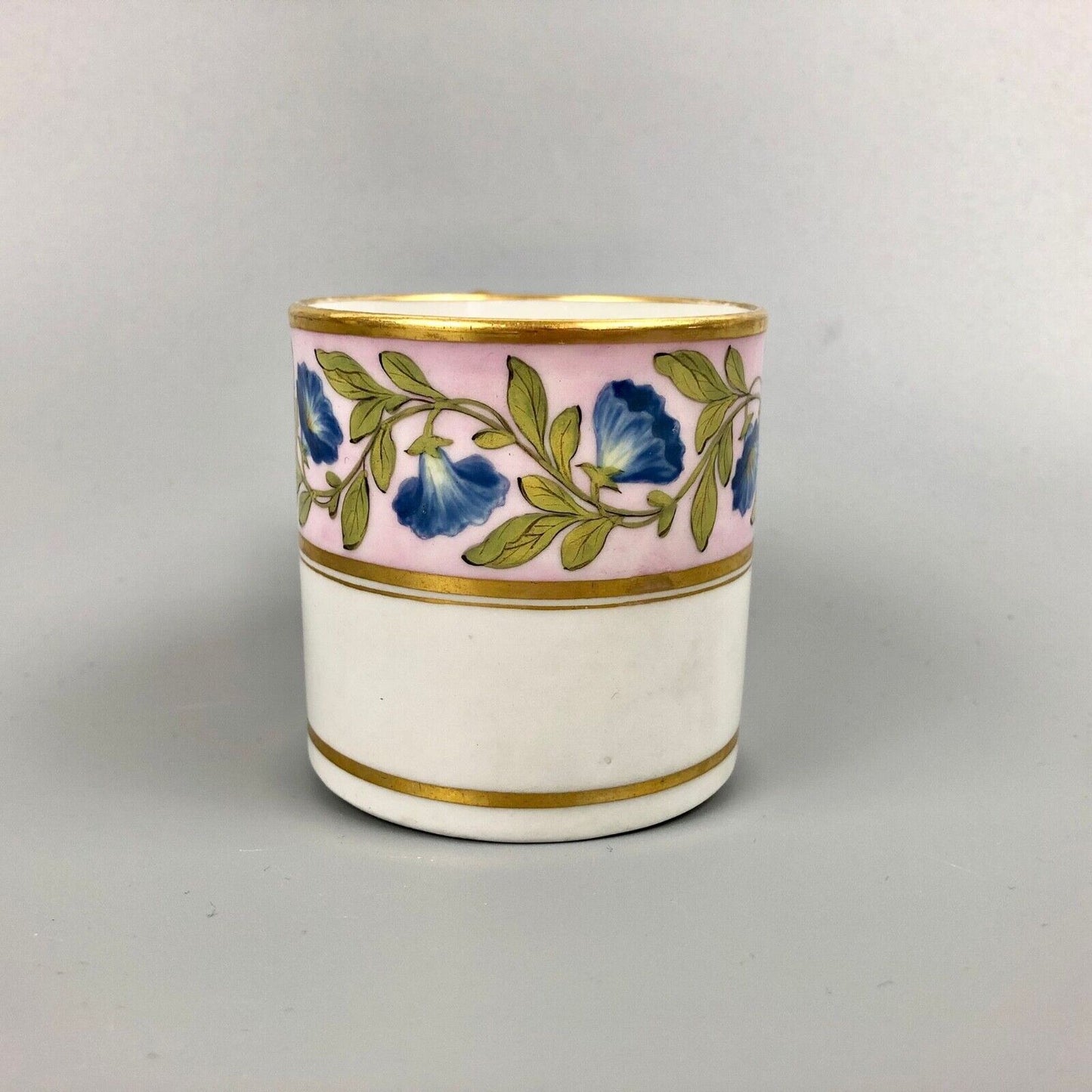 A Barr Worcester coffee can with a floral band on salmon ground c.1795-1805