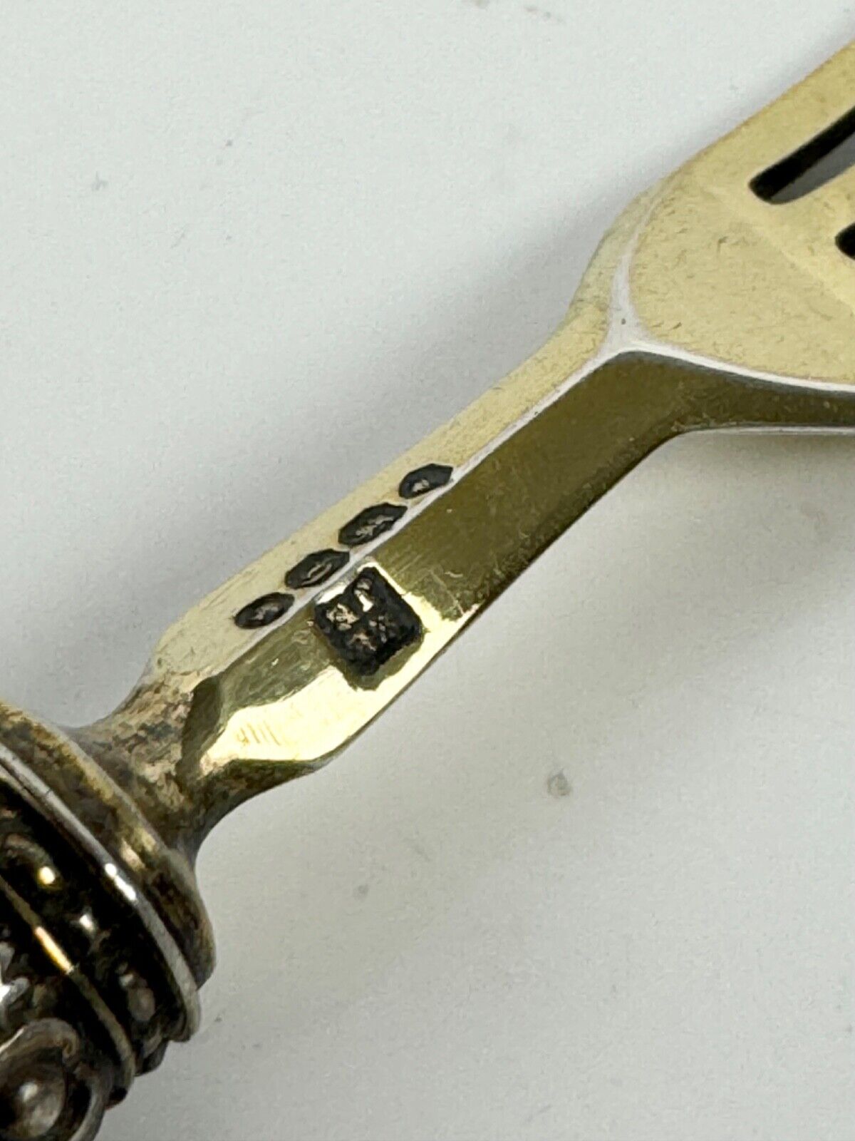 A sterling silver-gilt knife & fork set-the silver c.1863, the porcelain c.1760