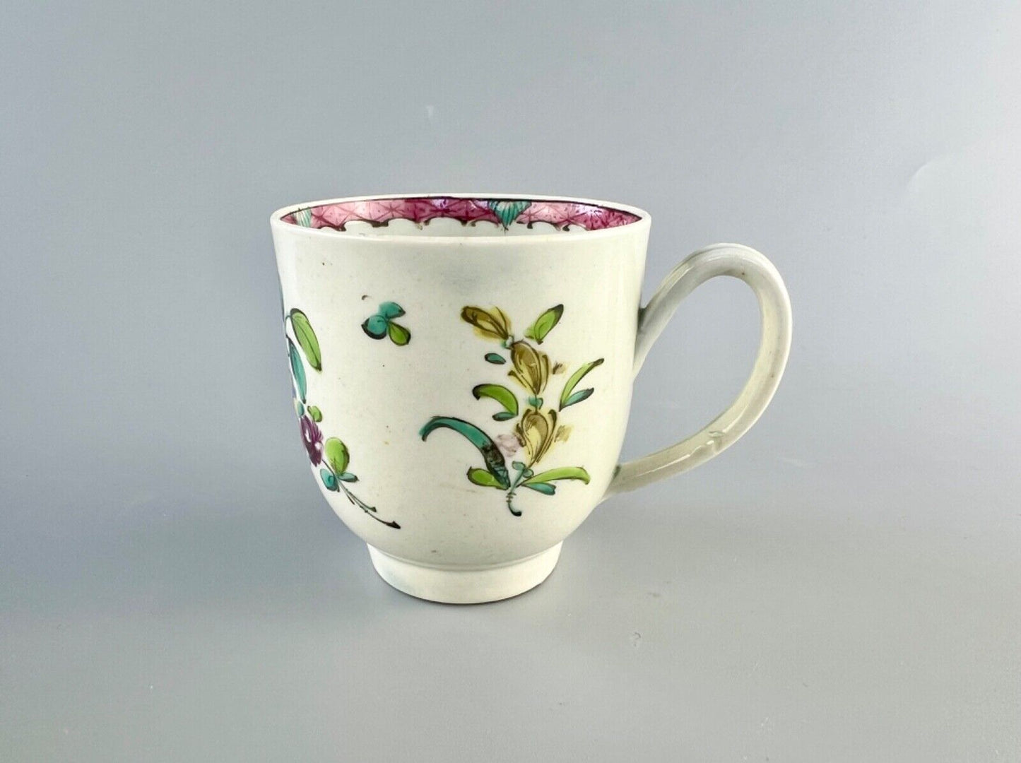 A Worcester polychrome pattern coffee cup with unusual rim decoration c.1770