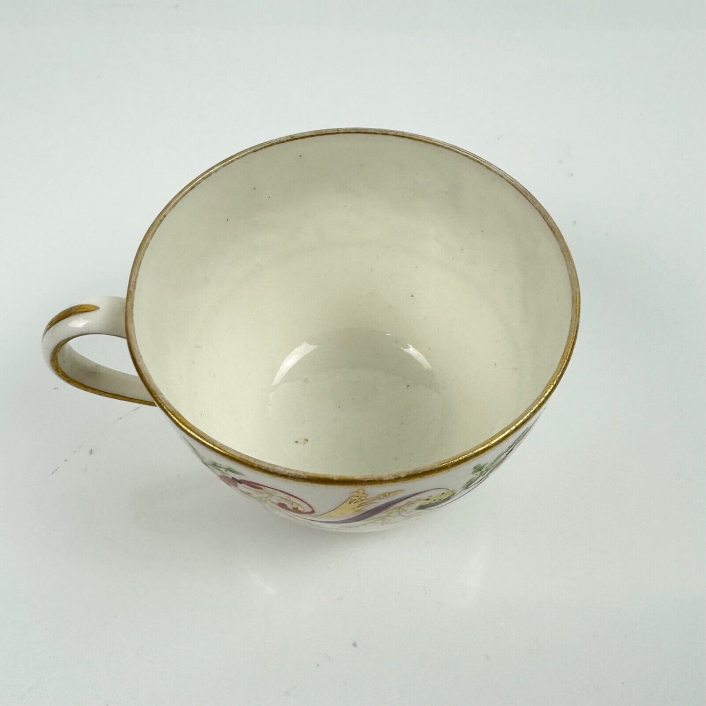 A good Pinxton tea cup and saucer c1796-9 in pattern 301.