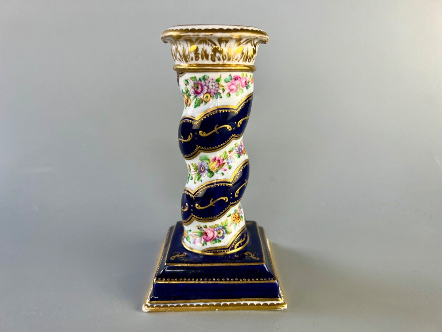 A pair of c 1810-25 Coalport Coalbrookdale spiral-moulded candlesticks.