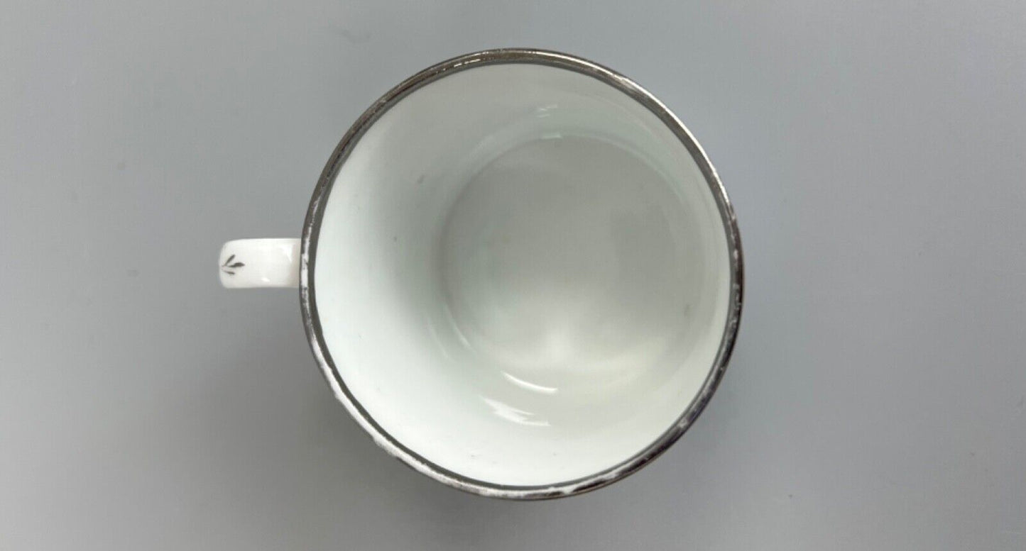 An early 19thc Coalport coffee can with silver lustre decoration.