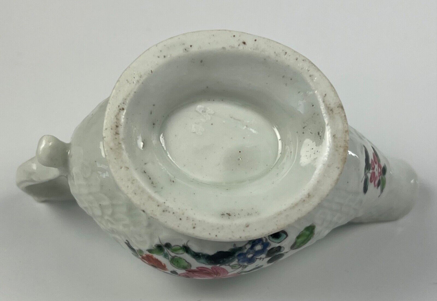 A Philip Christian Liverpool moulded polychrome porcelain sauceboat c.1770