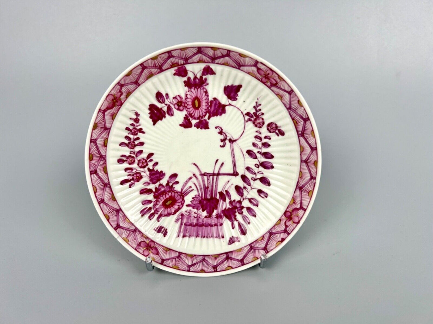 A rare Worcester reeded teacup and saucer painted in Meissen style. c.1772