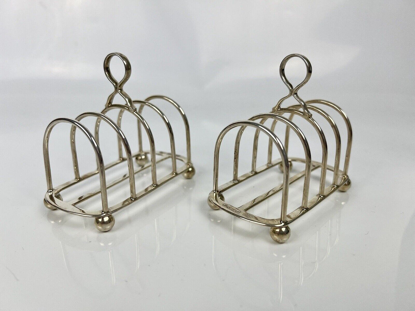 A Pair Of Goldsmith And Silversmith's Company Toastracks. Sheffield 1935.